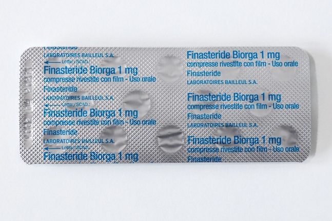 Featured image showing finasteride drug packet in MHRA warning about mental health and sexual side effects